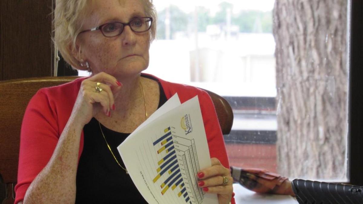 
Harper County Commissioner Carla Pence looks over an earthquake report at Tuesday’s meeting with state officials.
