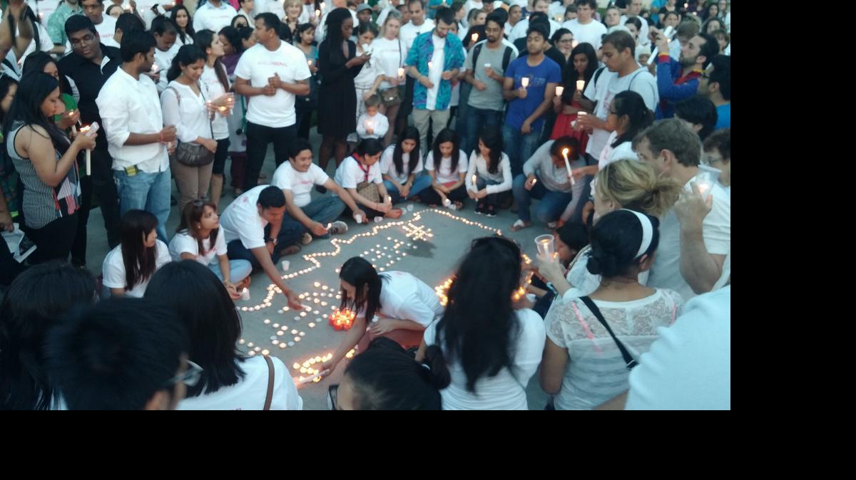 
About 300 people gathered Sunday evening at Wichita State University for a candlelight vigil for Nepal, which was struck by a major earthquake on April 25. (May 3, 2015)

