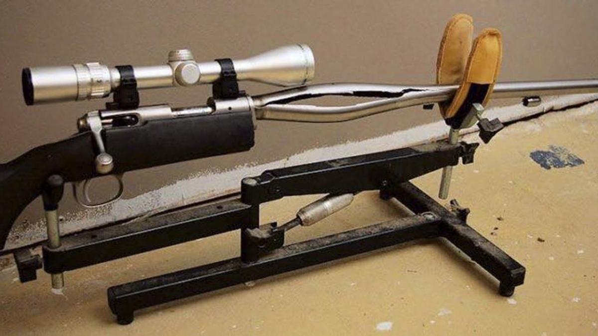 In this 2009 photo provided by Trent Procter, a Savage Arms stainless steel 10ML-II muzzleloader owned by Procter of Swan River, Manitoba, Canada, is displayed weeks after its barrel exploded and severely injured his left hand. Savage Arms recently agreed to pay a confidential settlement to Procter to resolve his lawsuit, one of several that allege the company kept a defective firearm on the market.