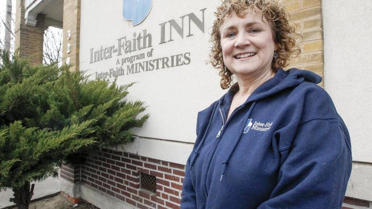 Inter-Faith Inn executive director Anne Corriston outside the main shelter near Broadway and Central. (Nov. 26, 2014)
