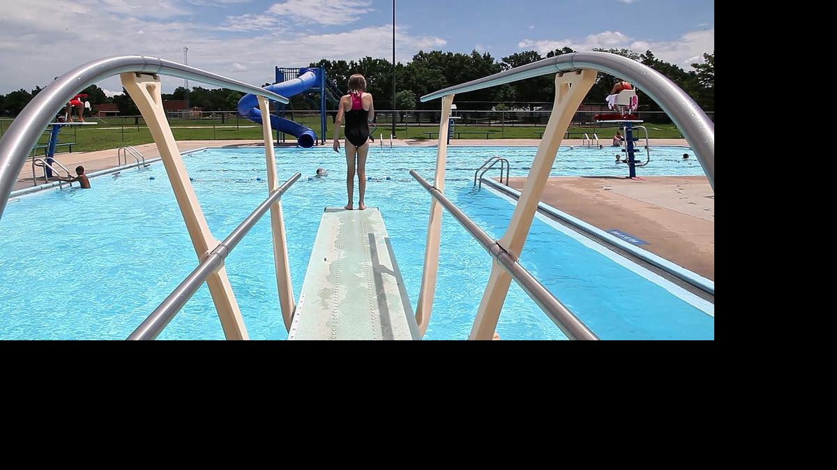 
A reluctant diver ponders before jumping into the Harvest swimming pool in west Wichita. (Aug. 7, 2013)
