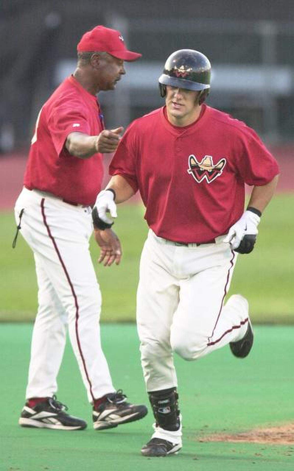 FILE Wichita Wrangler Alex Gordon gets congratulated by manager Frank White after a home run against the Tulsa Drillers in 2006.