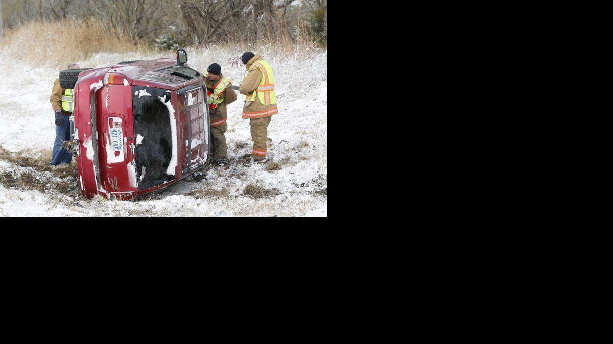 
Belle Plaine firefighters examine a van that swerved onto its side near Belle Plaine. Nobody was injured. (Nov. 16, 2014)
