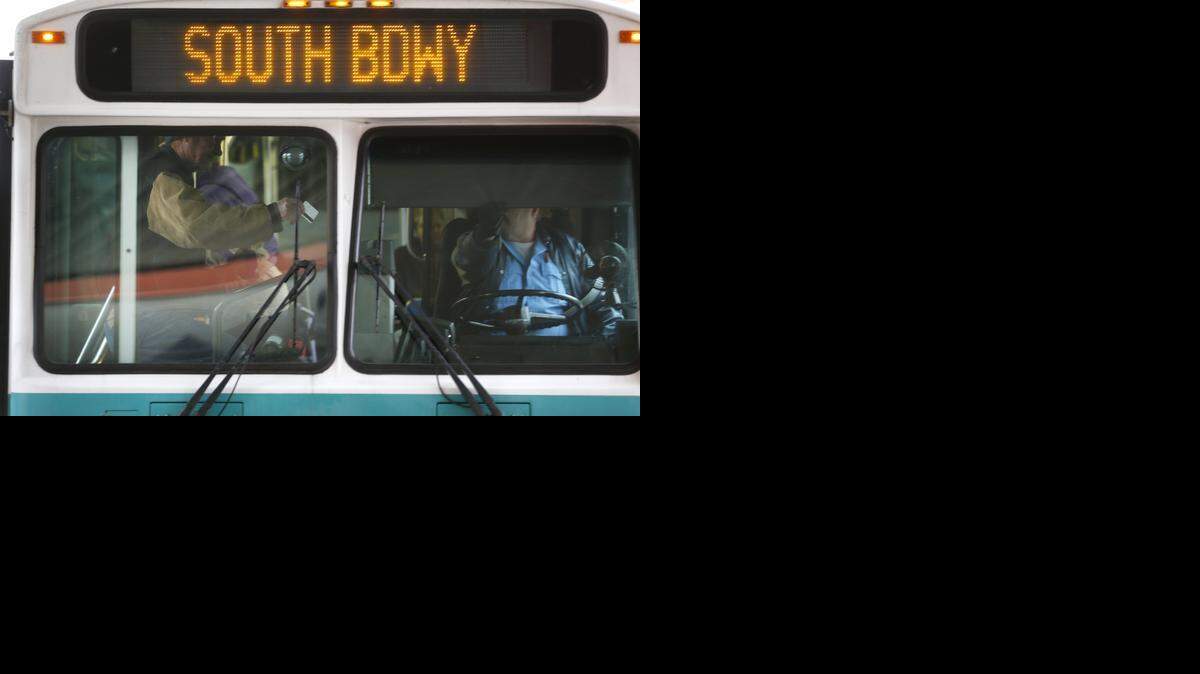 
A rider boards a bus Monday at the Downtown Wichita Transit center. (Dec. 15, 2014)
