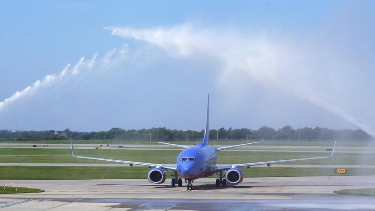 This Southwest Airlines plane from Dallas was the first flight into Dwight D. Eisenhower National Airport. It taxied under a water arch sprayed by firefighters. (June 3, 2015)