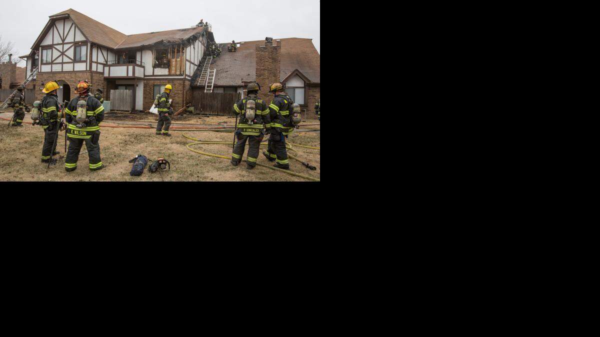 
Firefighters work at the scene of an apartment fire that was called in around 9 a.m. on Friday morning in the 9000 block of East Lincoln. 
