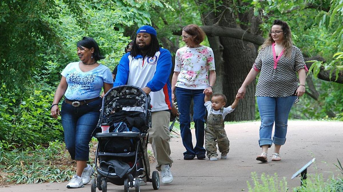 
Visitors walk the paths Sunday during the Mother’s Day event at Botanica.
