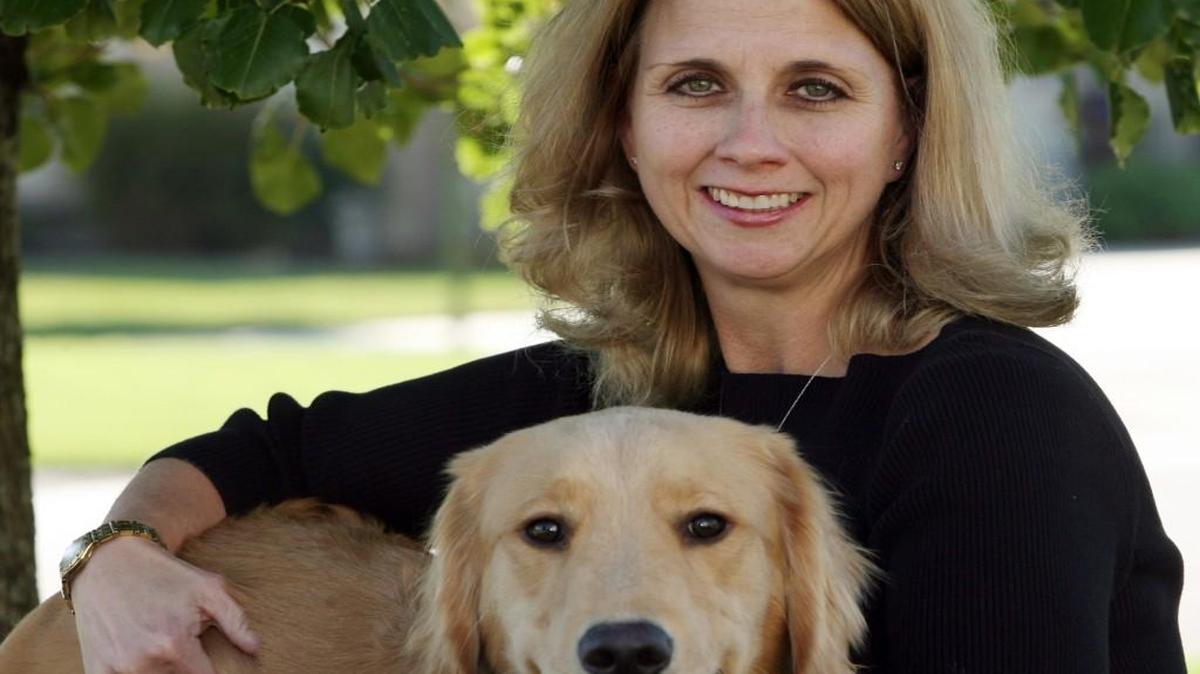 Kristi Zukovich with her Golden Retiever, Levi.