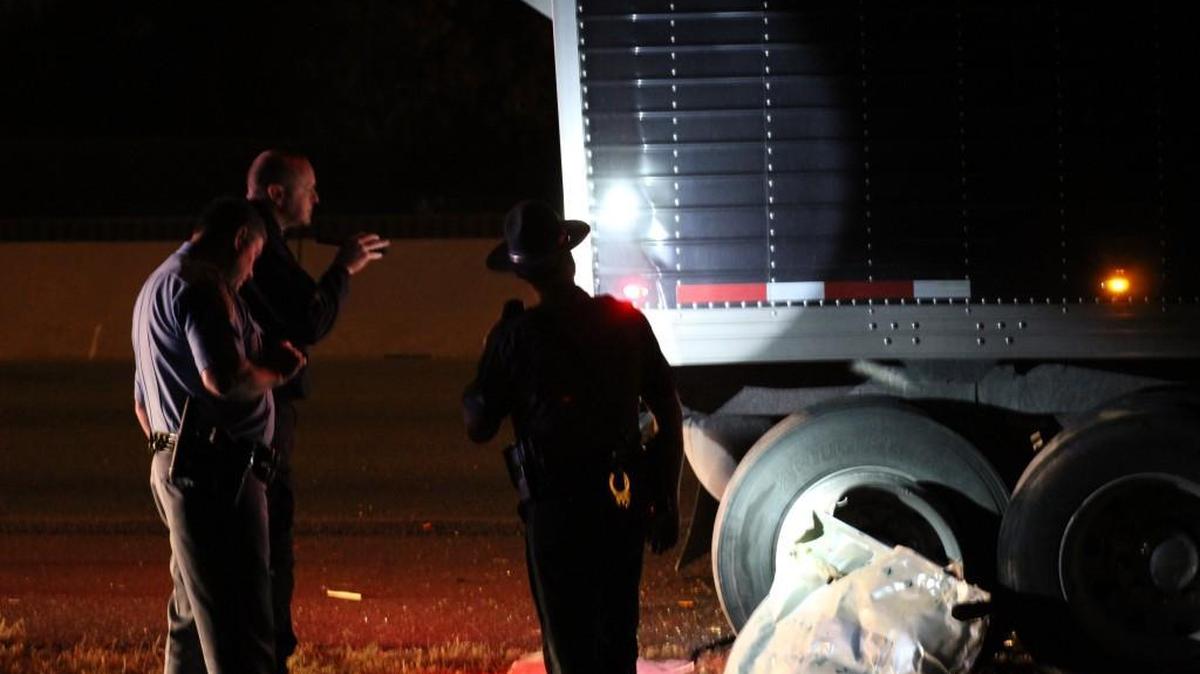 Troopers with the Kansas Highway Patrol investigate Tuesday night after a fatal crash on I-135 just north of Mount Vernon.