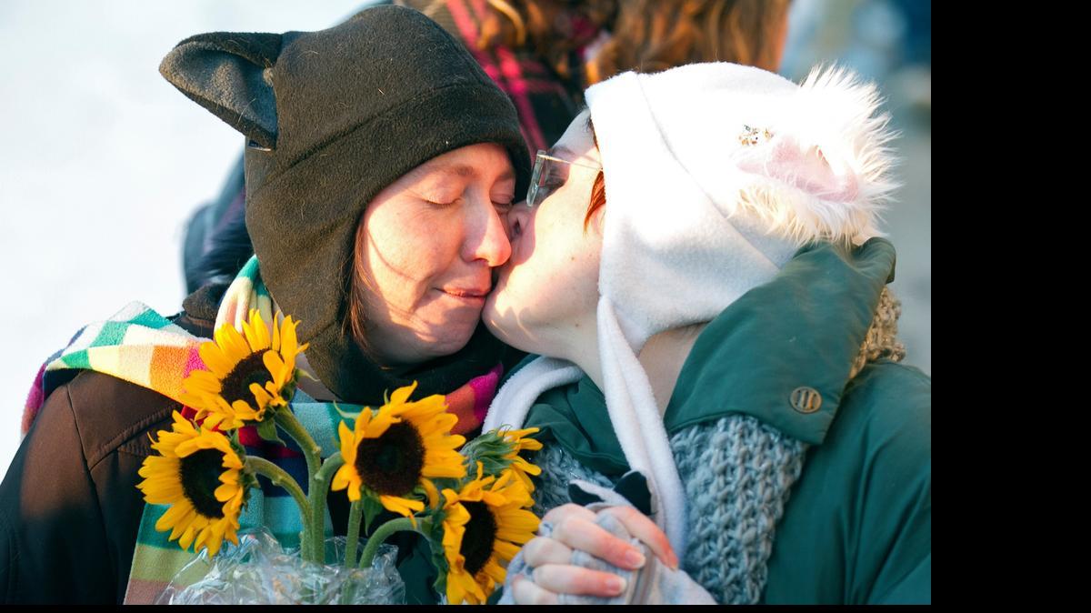 
Same-sex couple Sonja, left, and Terra prepare for a mass marriage ceremony on the steps of the Historic Sedgwick County Courthouse in Wichita in 2014. (Nov.17, 2014)
