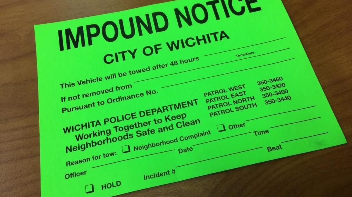 On Tuesday, Wichita police will be placing these green impound stickers on vehicles parked on city streets. Owners have until Thursday to move the vehicles or risk a tow. (May 8, 2017)