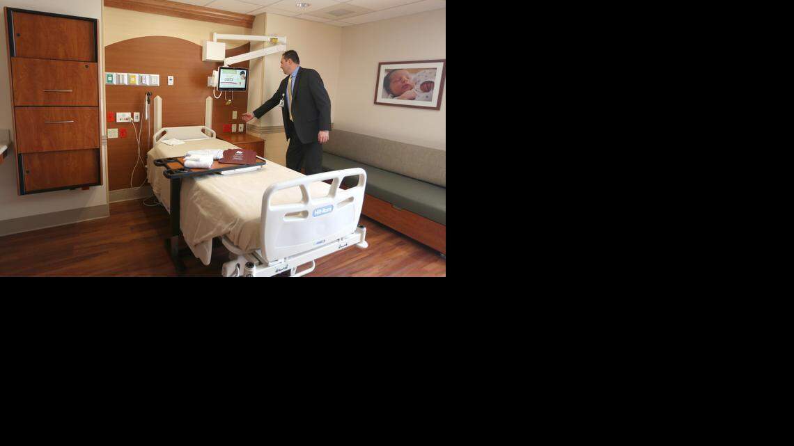 
Wesley Medical Center interim CEO Bill Voloch stands in a newly remodeled women’s birthing room. Wesley recently completed a $36 million renovation of its women’s care units.
