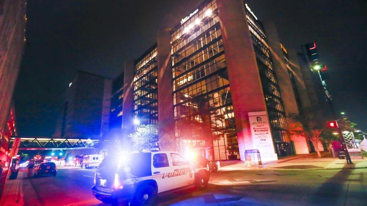 Police, ambulances and firetrucks block off Broadway between Douglas and First Street after a report that a man was threatening to jump from the Ruffin Building on Tuesday night. (May 24, 2016)
