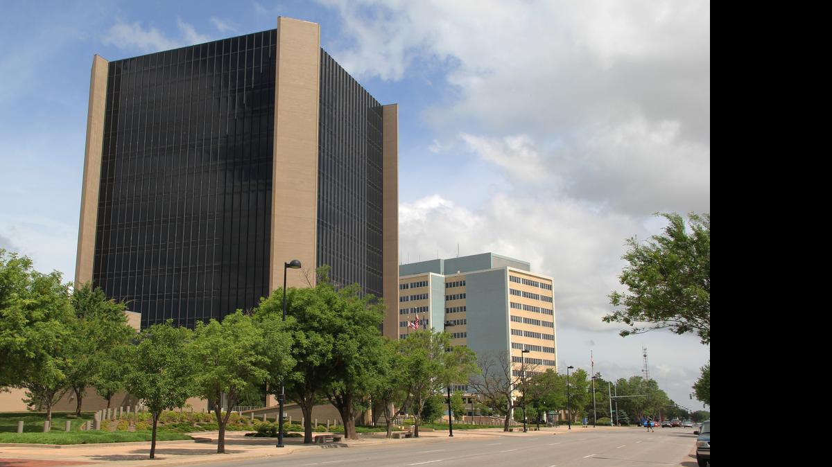 
Effects of the rift between leaders at Wichita City Hall, left, and the Sedgwick County Courthouse reach beyond either government building. 
