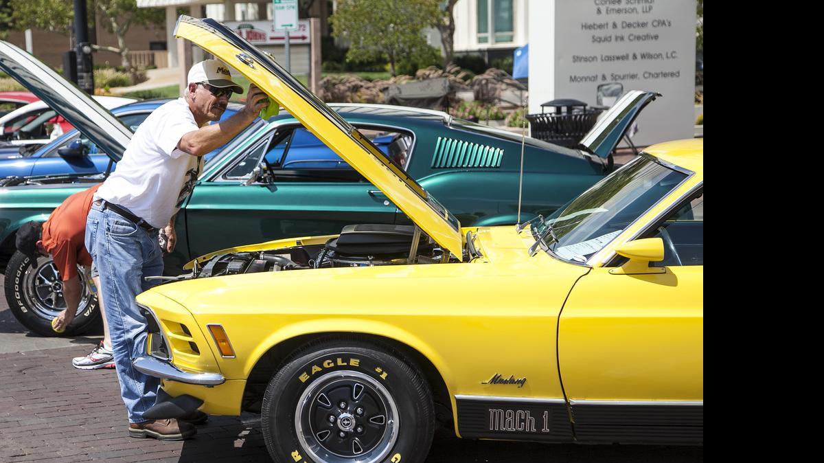
Tom McCreary of Wichita preps his 1970 Ford Mach I for show at the BlackTop Nationals in August. (2014)
