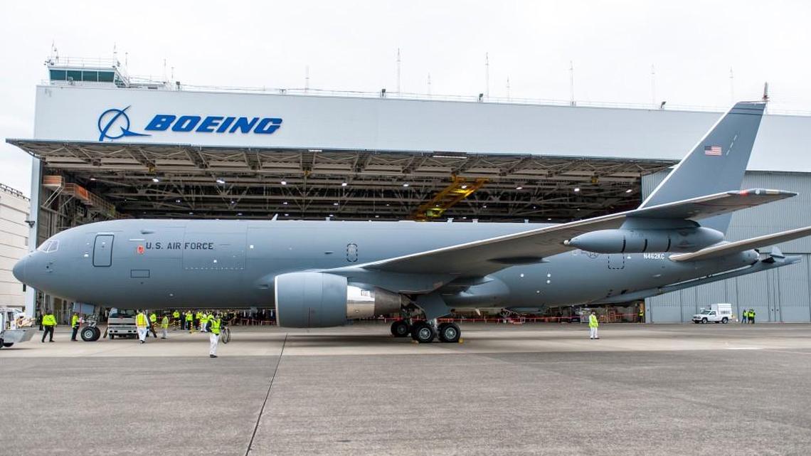 Crews examine a KC-46A tanker at its first flight on Sept. 25, 2015, in Everett, Wash.