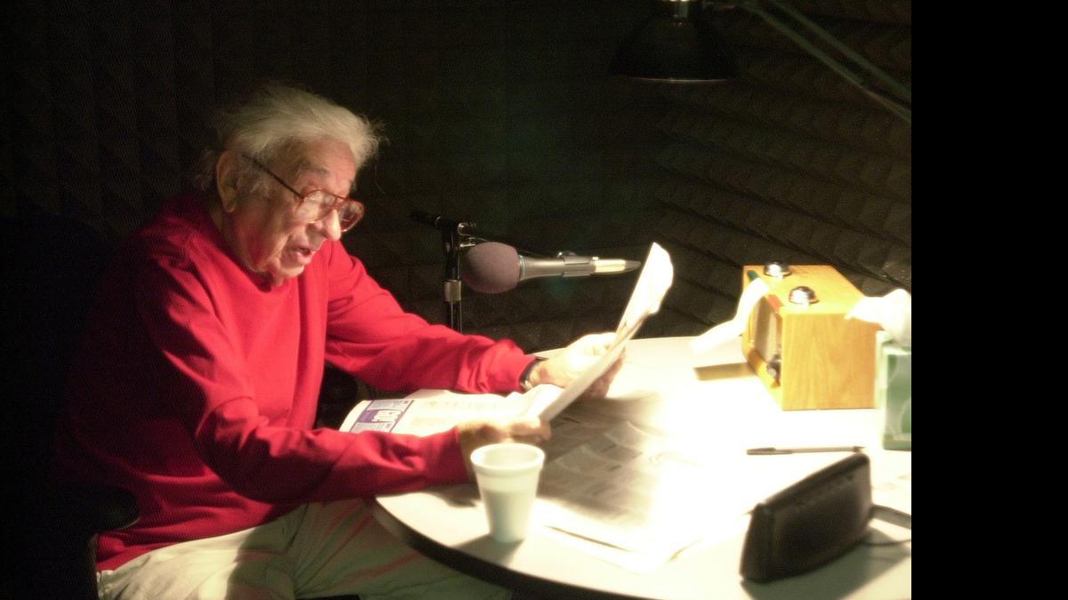 
Dick Welsbacher reads the newspaper in 2005 on a radio program for the visually impaired. Dr. Welsbacher died Tuesday at age 89.
