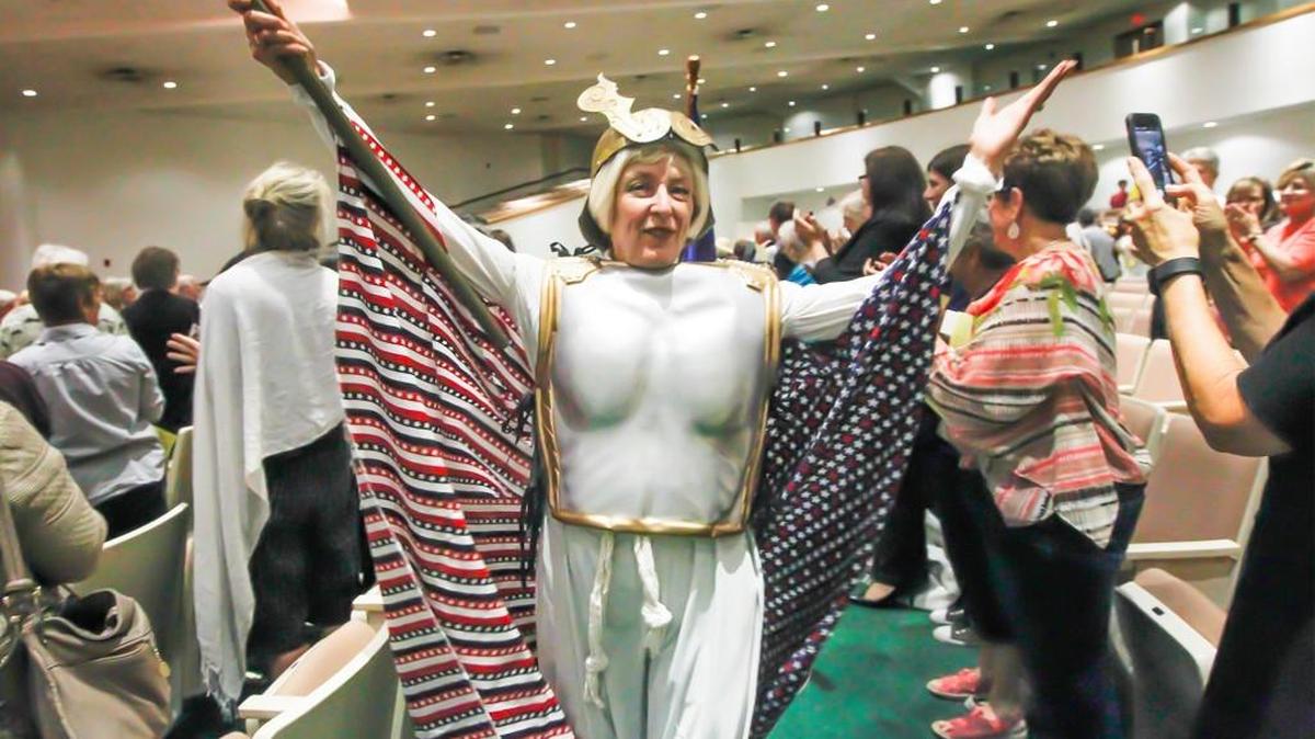 
Gina Austin-Fresh leads the Suffrage Grand March to kick off the night Wednesday for the Wichita League of WomenVoters’ 95th anniversary celebration of the 19th Amendment. (Aug. 26, 2015)
