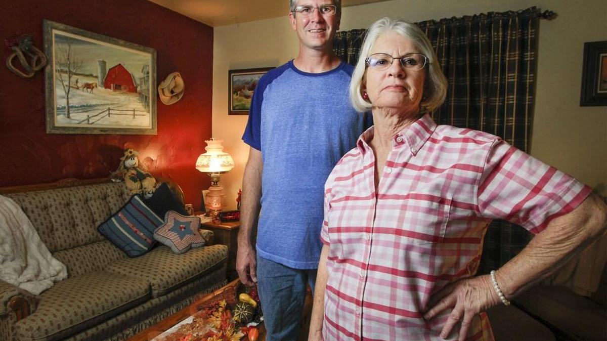 Gin Allen, right, and her son, Allen, have given about a third of their income to the Living Word Outreach Church, which runs the Bread of Life food pantry.