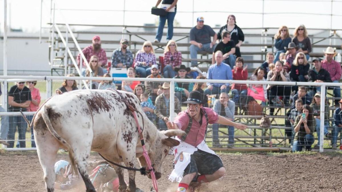 Skip Miller, son of Mike and Shelly Miller, distracts a bull on Sunday afternoon. The Bull Blowout benefit rodeo in Mulvane raised money for the Miller family. (Oct. 30, 2016)