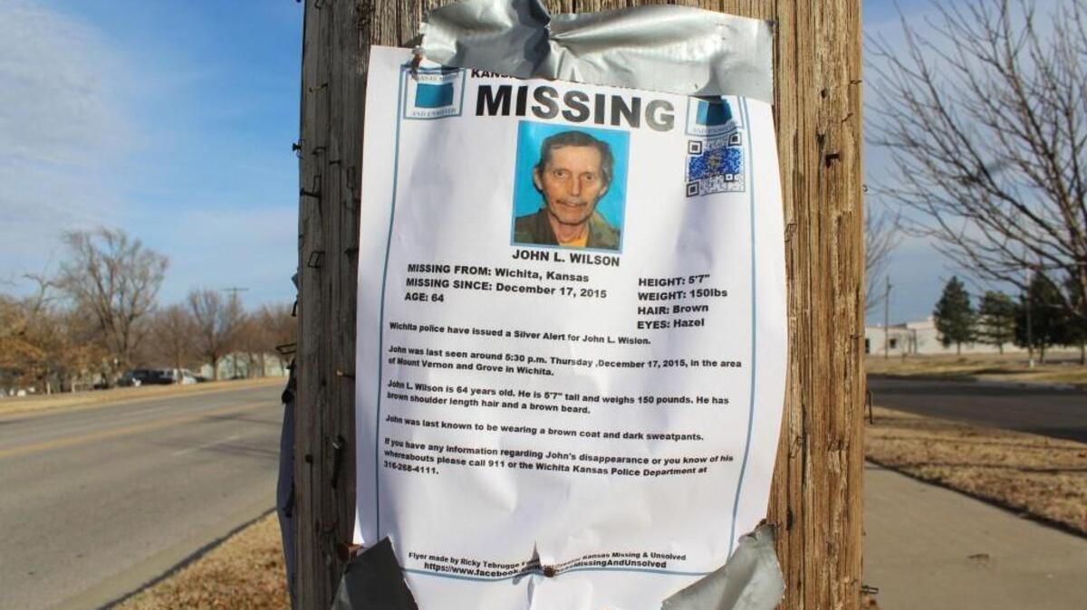 John Wilson’s missing poster hangs on 31st Street South in south Wichita.