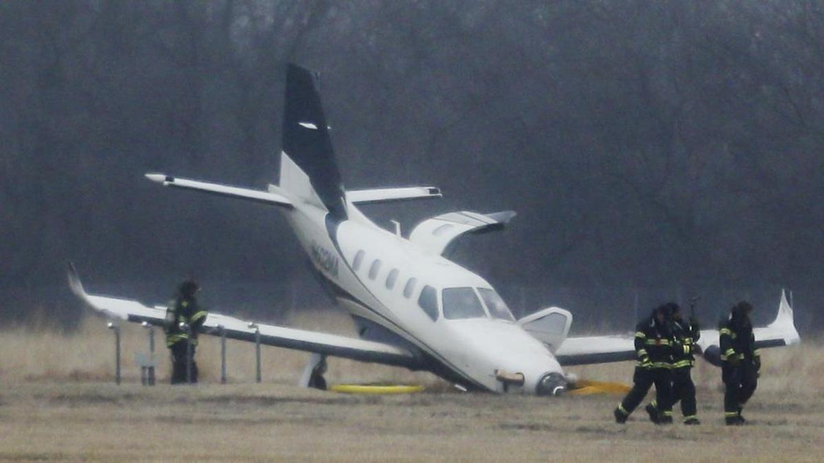 Firefighters work around a plane that crash-landed just north of the runway at Jabara Airport on Jan. 19.