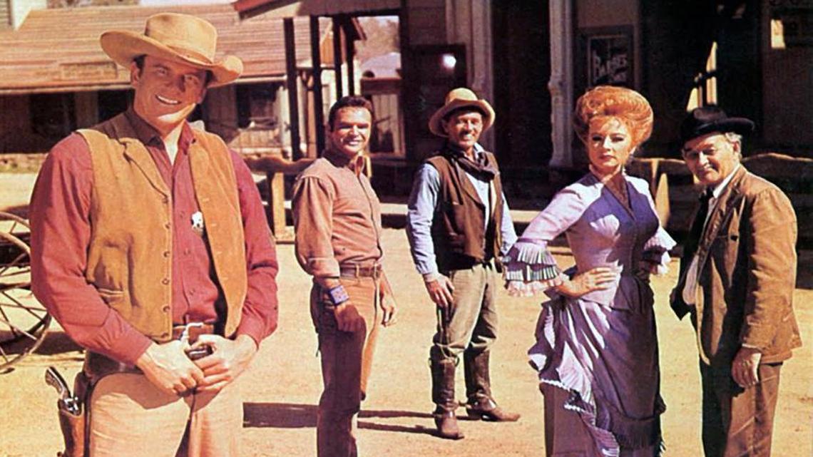 
“Gunsmoke” debuted on television in 1955. Stars of the show included James Arness as Matt Dillon; Burt Reynolds, who starred as Quint Asper, the blacksmith; Ken Curtis as Festus; Amanda Blake as Miss Kitty; and Milburn Stone as Doc Adams.
