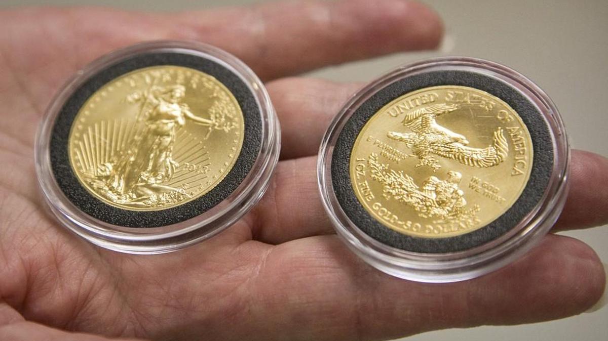 Gold coins like these were presented to the Guadalupe Clinic and the Lord’s Diner. (Dec. 15, 2015)