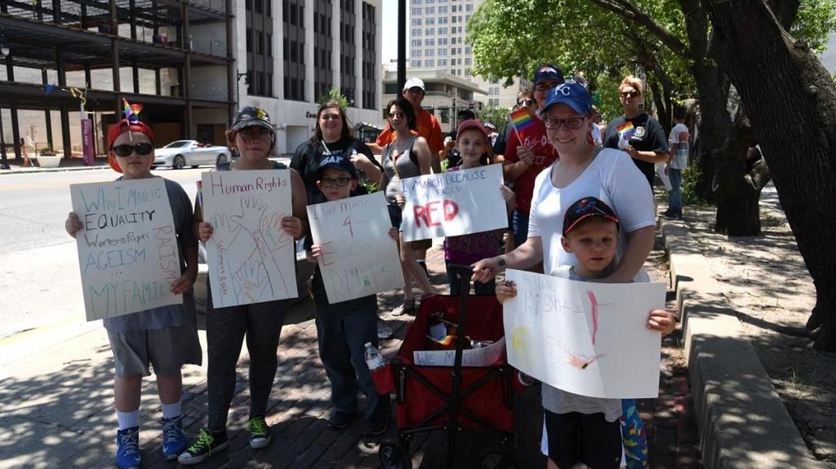 A family shows their support Sunday during Wichita’s Equality March. (June 11, 2017)