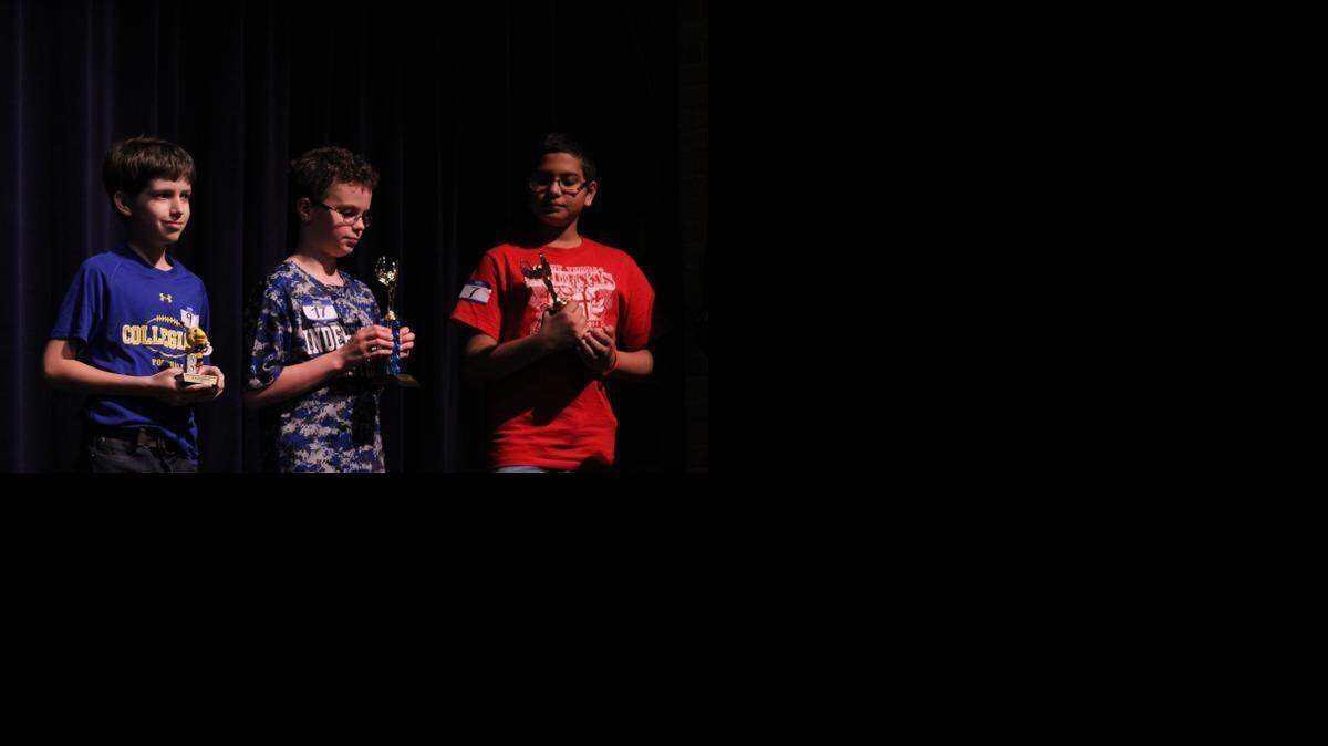 
From left, Conor Reid-Tedesco of Wichita Collegiate School, Matthew Janssen of the Independent School and Joe Bijoy of St. Thomas Aquinas Catholic School won first- through third-place trophies Saturday at the Sedgwick County Spelling Bee.
