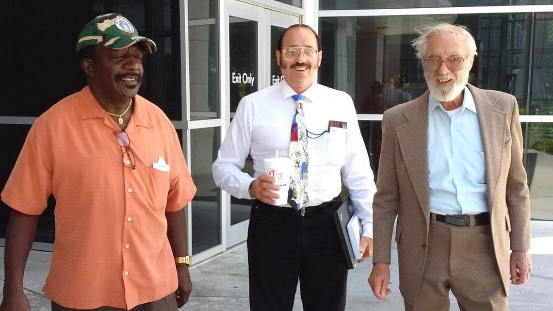 Anti-abortion activists Joseph Elmore, Mark Gietzen and David Schmidt leave the Sedwick County courthouse with smiles after Schmidt’s acquittal on charges of battering a security guard at the South Wind Women’s Center.