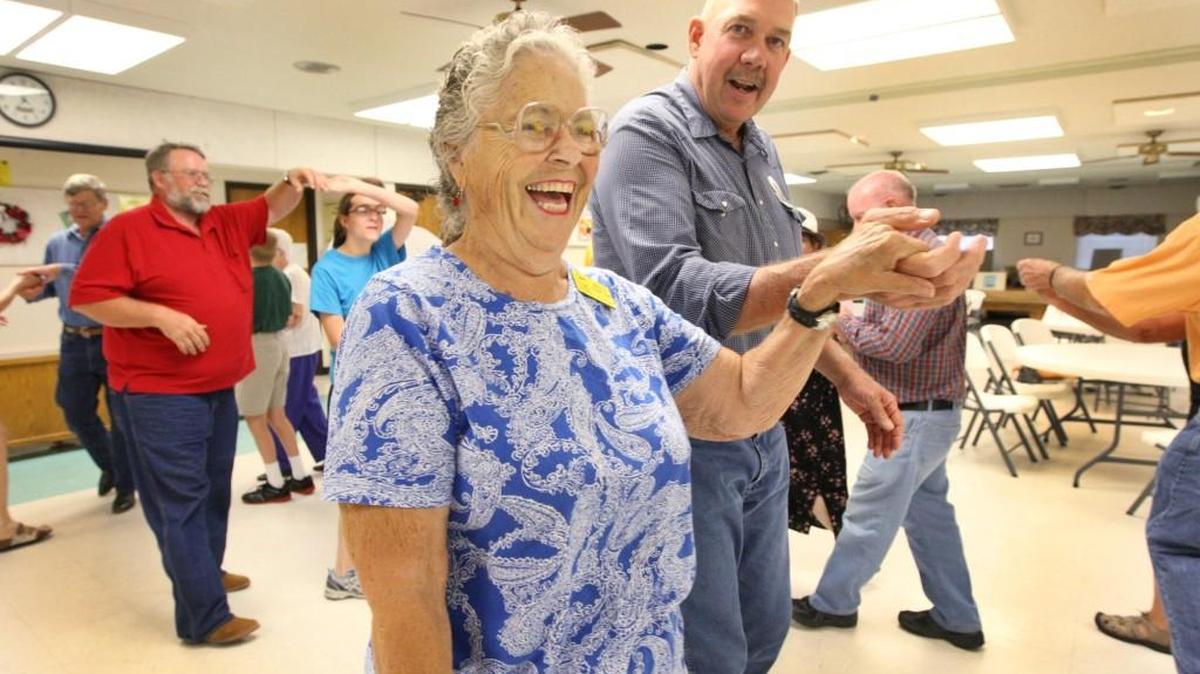 Gretta Costlow and Bob McVey and others at the Park City Senior Center enjoy some square dancing in 2012.