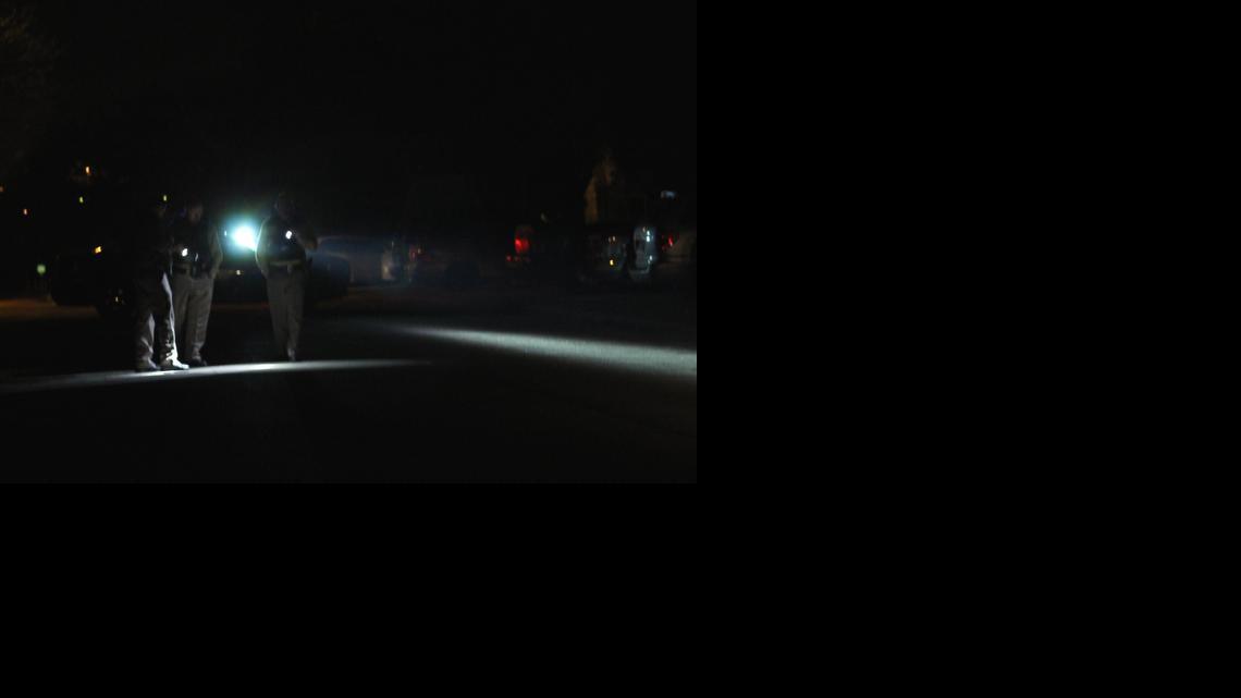 
Wichita police officers search for evidence from a shooting near Roosevelt and Cessna streets in Planeview on Tuesday evening.
