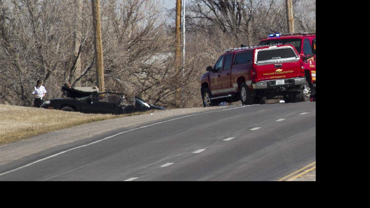
Wichita and Sedgwick County officers investigate the scene of a fatal single-car crash near Pawnee and Woodlawn in March. A black Monte Carlo left the roadway around 1 p.m. and struck a utility pole. Two people died at the scene and two more suffered potentially serious injuries. 
