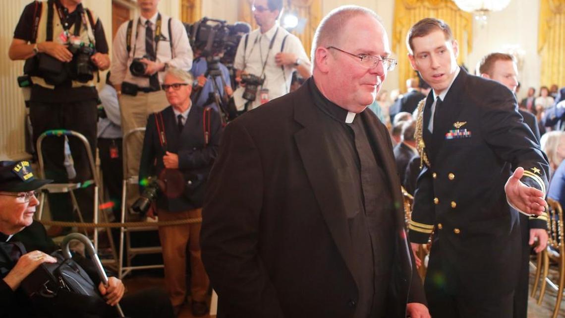 Father John Hotze of Wichita, who led the investigation for the cause of Sainthood for Fr. Emil Kapaun, enters the White House East Room for a ceremony in 2013 in which Kapaun was awarded the Medal of Honor posthumously.