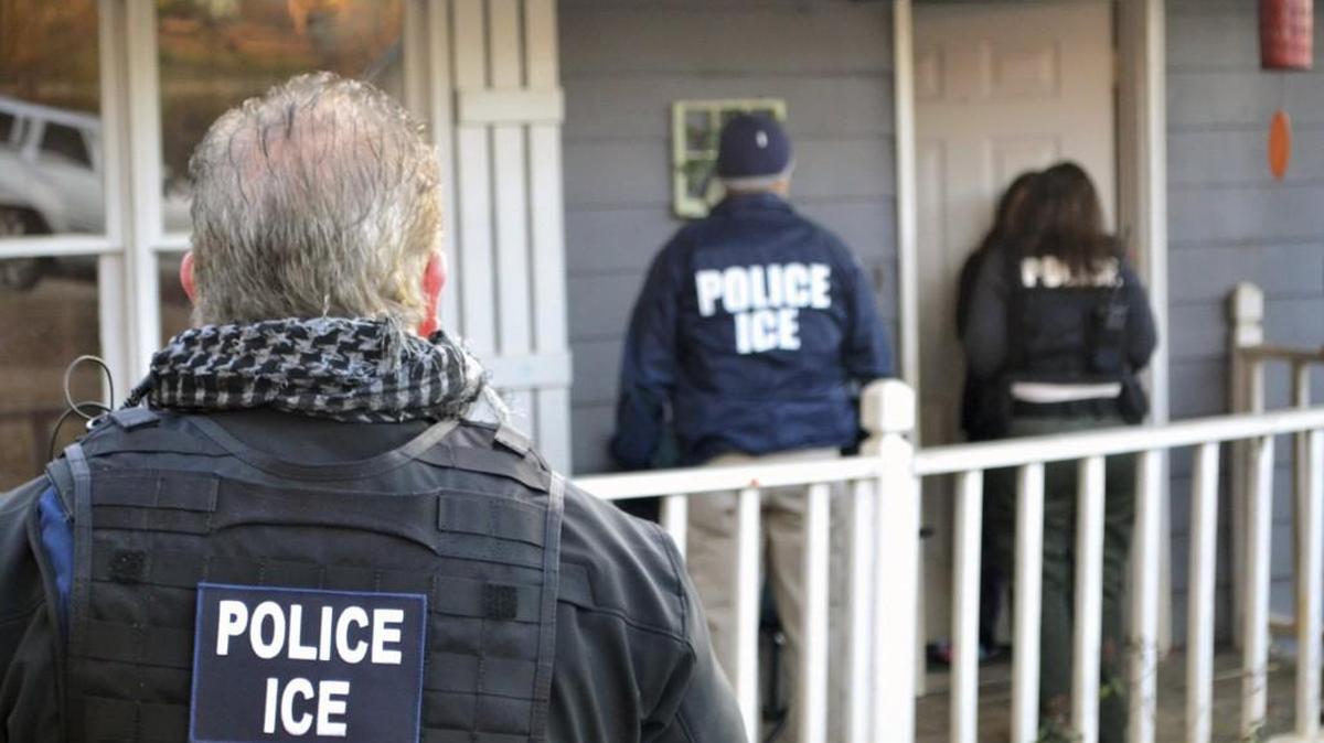 Immigration and Customs Enforcement agents investigate at a home in Atlanta during a nationwide targeted immigration enforcement operation that included arrests in Kansas. (Feb. 9, 2017)
