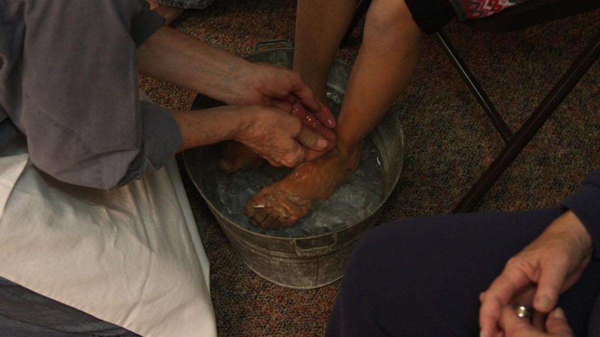 Members of First Church of the Brethren demonstrate a ritual foot washing, which they do every year during Thursday of Holy Week.