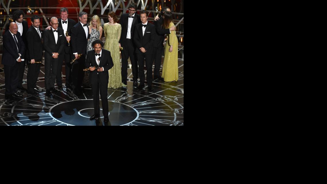
Alejandro G. Inarritu, center, and the cast and crew of “Birdman or (The Unexpected Virtue of Ignorance)” accept the award for the best picture at the Oscars on Sunday, Feb. 22, 2015, at the Dolby Theatre in Los Angeles. 
