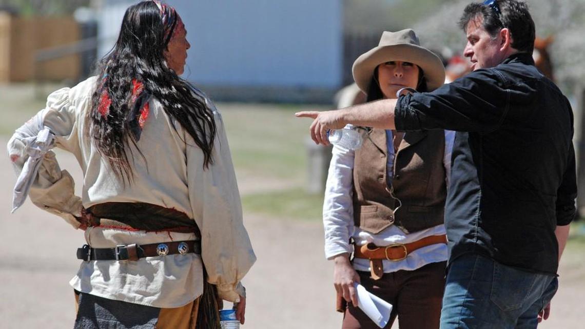 Cinematographer Jason Opat, right, explains a scene to director Ricky Lee and actress Micky Maddux during filming Sunday of “Midnight Shanghai” at Cowtown. (April 3, 2016)
