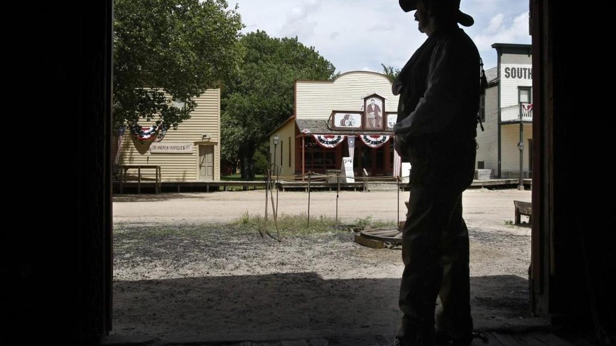 A re-enactor at Cowtown stands in the doorway of the blacksmith’s shop at Cowtown Museum. Cowtown has a new director.