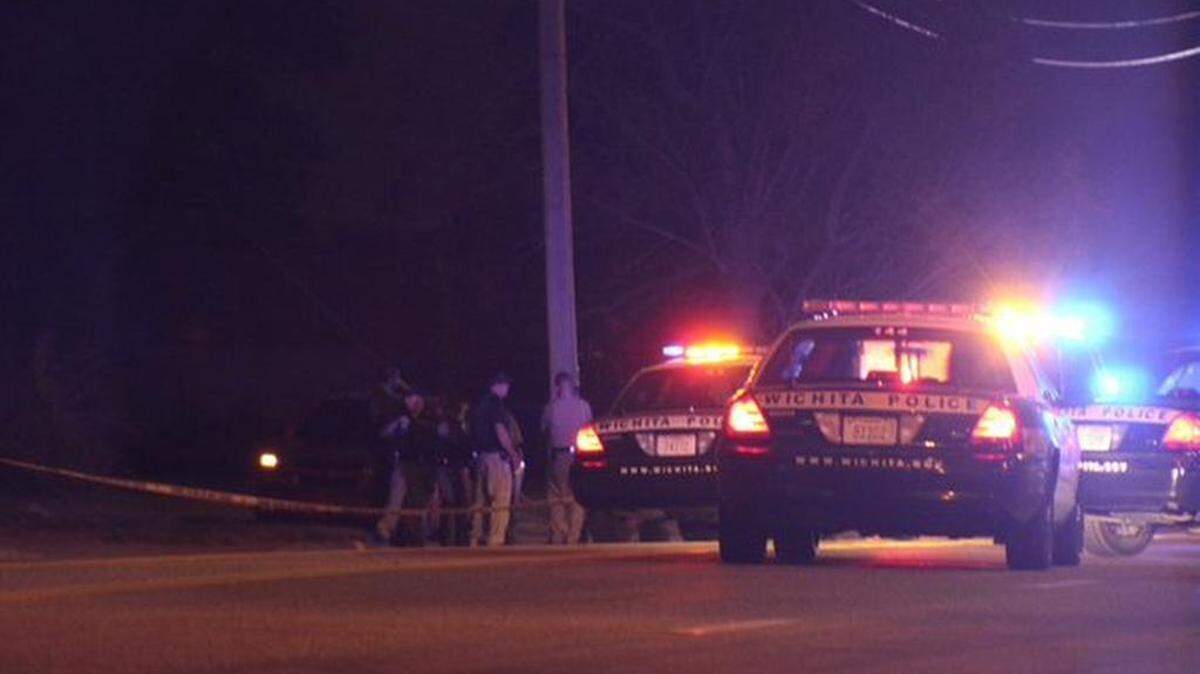 Wichita police investigate at the scene of a reported fatal shooting near 53rd Street South and Meridian, one of two reported fatal shootings late Thursday. (Oct. 22, 2015)