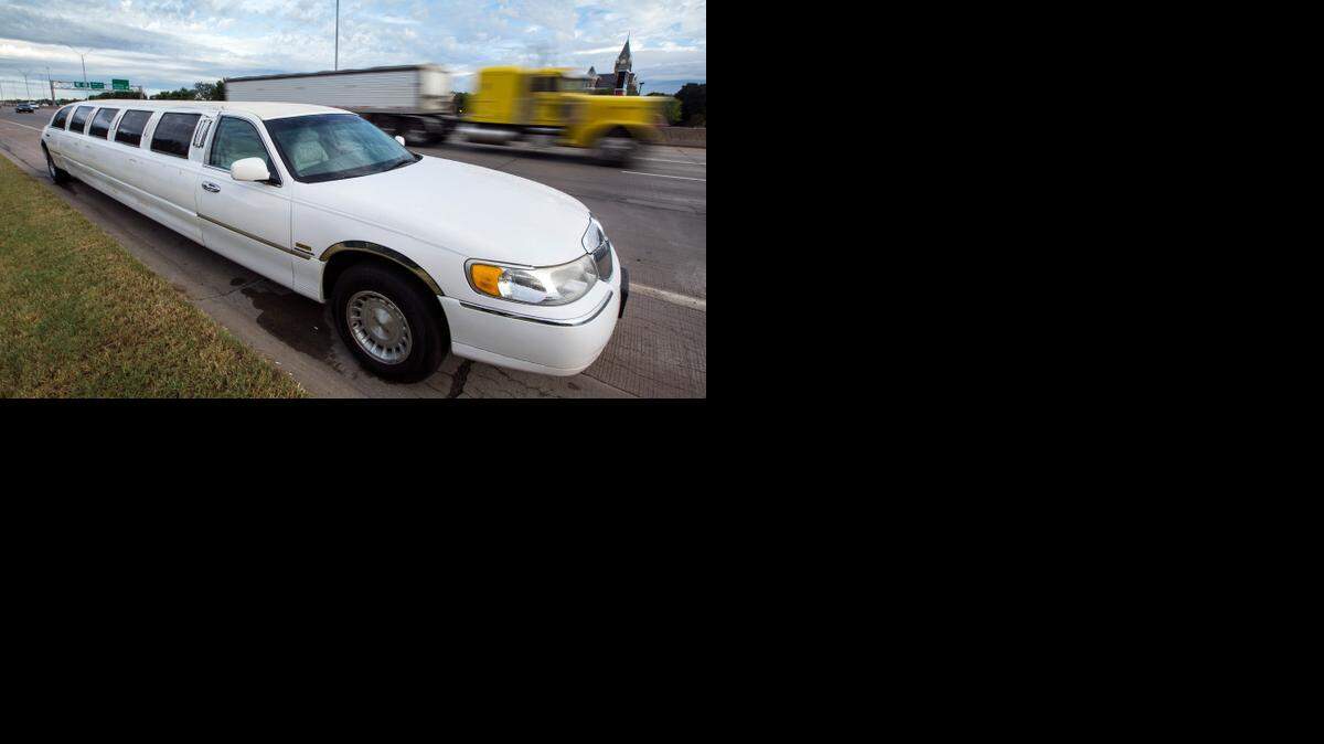 
Friday morning rush-hour traffic blasts past an abandoned white Lincoln limousine on eastbound Kellogg between Meridian and Seneca. The limo was tagged by law enforcement for several days. 
