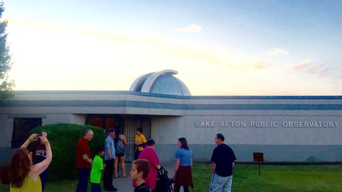 Stargazers line up outside the Lake Afton Public Observatory on Friday; the observatory reopened a year after budget cuts closed it.