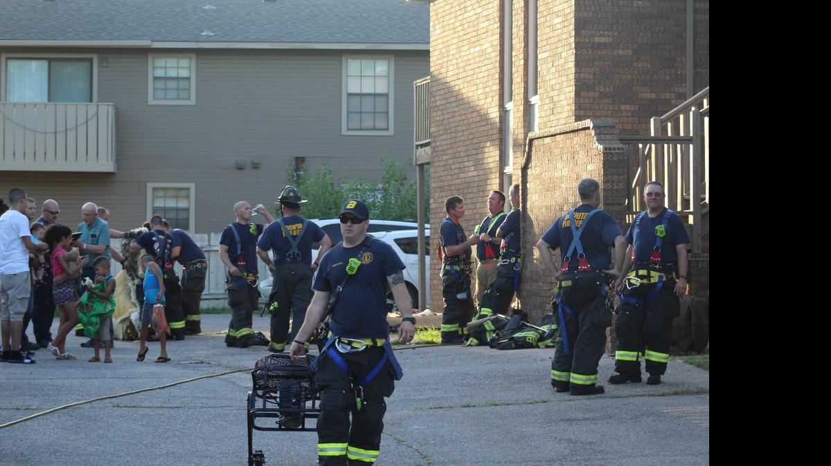 
Wichita firefighters respond to an apartment fire Saturday evening on West Par Lane. A 65-year-old woman is in critical condition after receiving “respiratory burns,” a Sedgwick County emergency dispatcher said. (June 20,2015)
