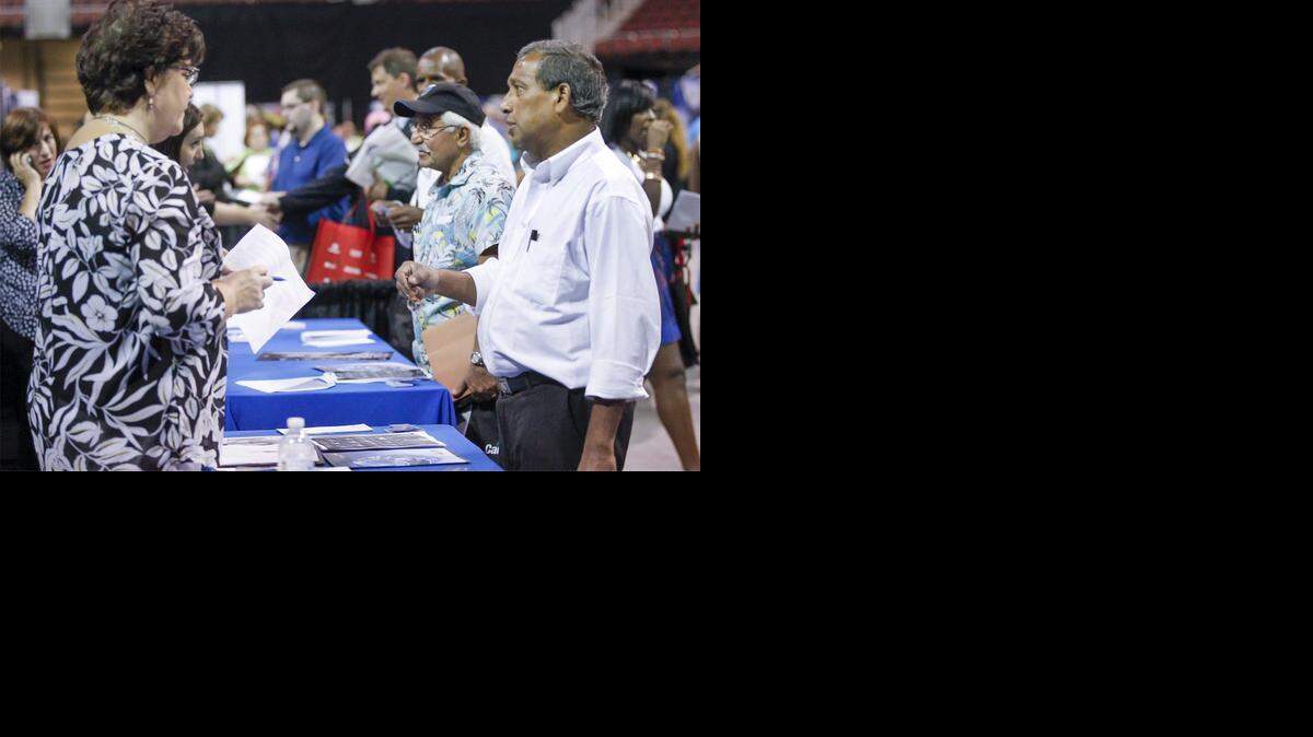 
WATC student Hementa Das, right, talks with a representative from Spirit at a job fair organized by the Workforce Alliance. (Sept. 4, 2014)
