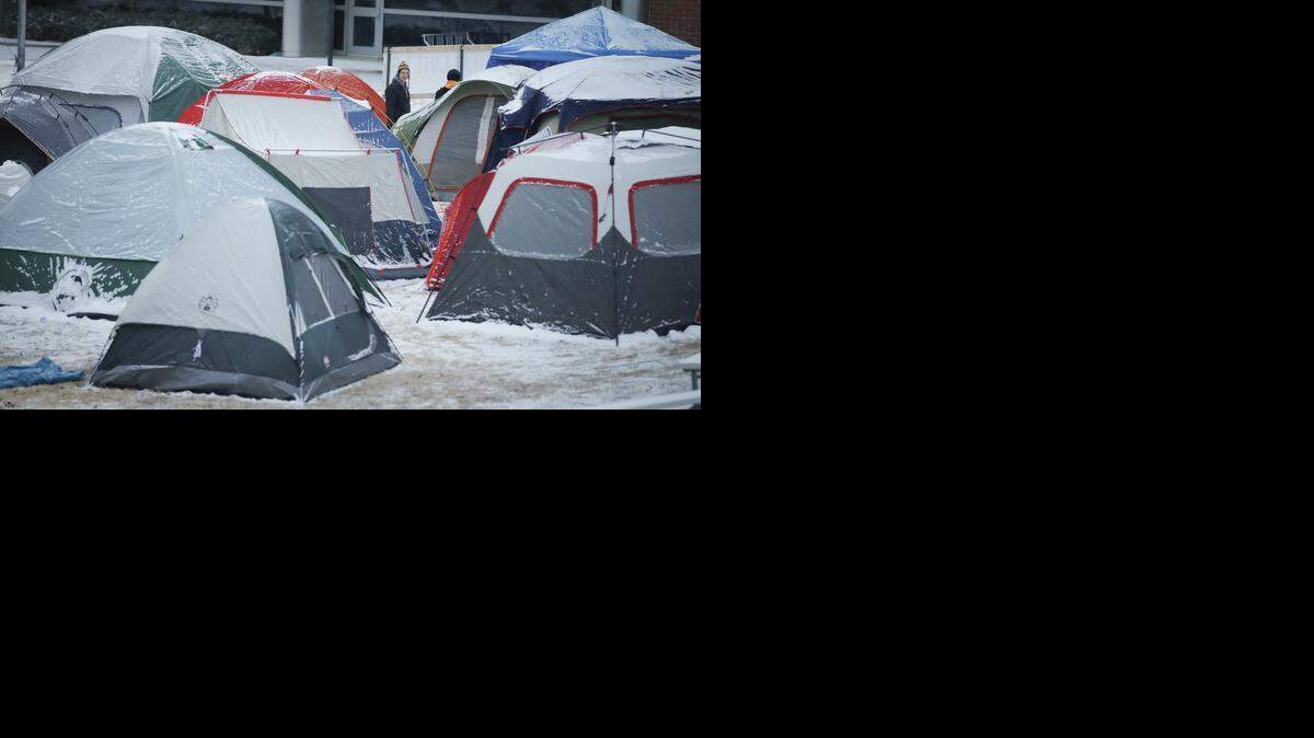 
Wichita State fans camp outside of Koch Arena on Friday night at “Marshallville.” Excitement is at an all-time high before Wichita State’s game against Northern Iowa for the MVC title tomorrow. ESPN’s College GameDay show is also broadcasting from Koch Arena on Saturday.
