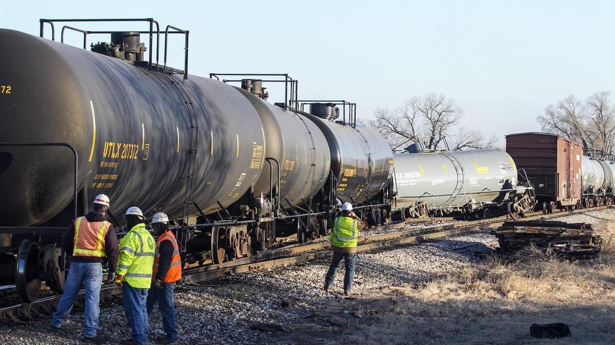 Railroad workers investigate the scene of a K&O train derailment in southwest Wichita on Thursday morning. (Feb. 11, 2016)