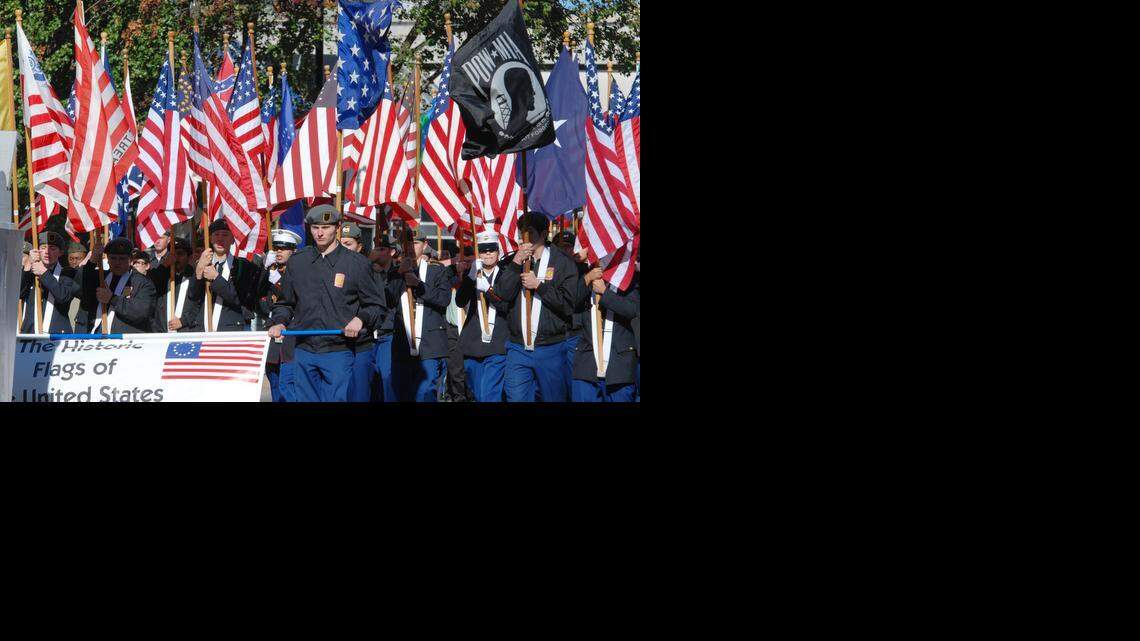 
Flags from different periods were carried Saturday in the Veterans Parade in downtown Wichita.
