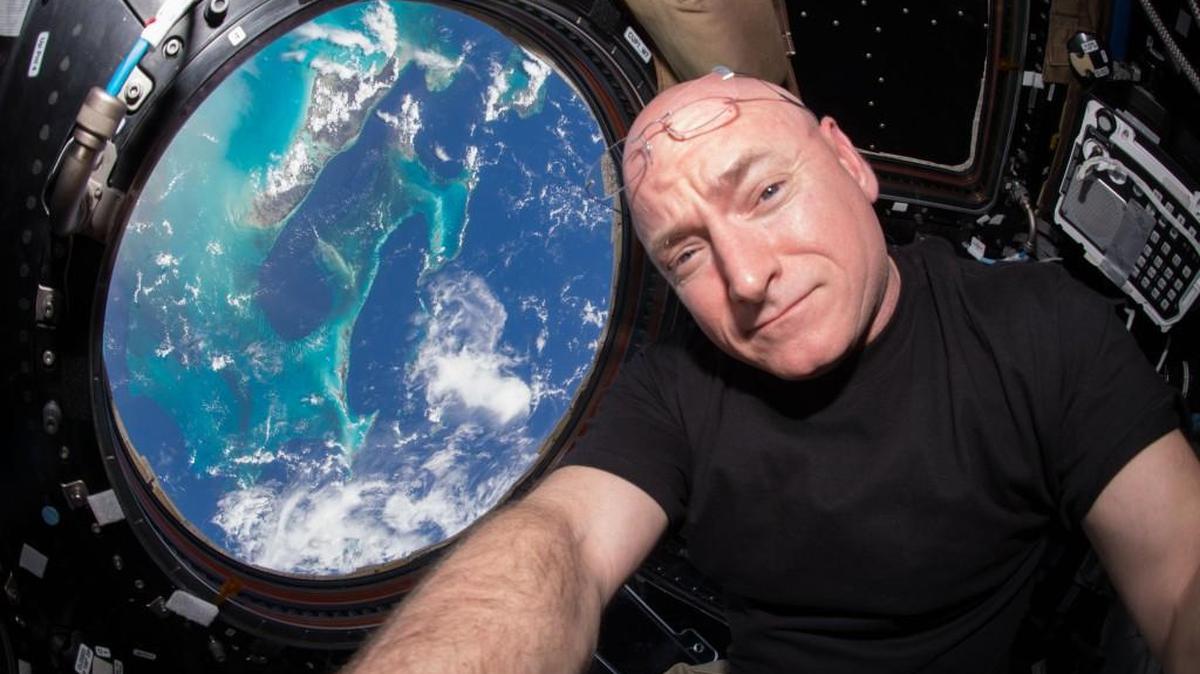 In this July 12, 2015 photo, sstronaut Scott Kelly takes a photo of himself inside the Cupola, a special module of the International Space Station which provides a 360-degree viewing of the Earth and the station.