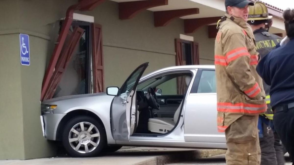A Lincoln MKZ jumped a curb and ran into a window at Innovative Physical Therapy in the Carriage Parkway strip mall near Central and Edgemoor on Friday.